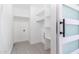 Walk-in closet with built-in shelves and clothing rod providing ample storage space at 1011 W Weldon Ave, Phoenix, AZ 85013