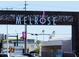 Neighborhood entrance sign for Melrose featuring a decorative metal archway at 1011 W Weldon Ave, Phoenix, AZ 85013