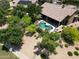 Aerial view of a backyard pool and outdoor space surrounded by green foliage at 1092 N Roosevelt Ave, Chandler, AZ 85226