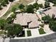 Stunning aerial view of property featuring mature trees, a manicured lawn, and private swimming pool at 1092 N Roosevelt Ave, Chandler, AZ 85226