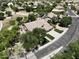 Charming home showcasing mature trees, pristine landscaping, and a large driveway with decorative turf at 1092 N Roosevelt Ave, Chandler, AZ 85226