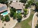 Aerial view of a home, green yard and pool in a leafy neighborhood at 1092 N Roosevelt Ave, Chandler, AZ 85226