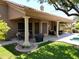 Expansive backyard featuring a covered patio, pristine lawn, and access to a refreshing swimming pool at 1092 N Roosevelt Ave, Chandler, AZ 85226