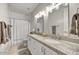 Bright bathroom with double sinks, granite countertops, and a shower-tub combination at 1092 N Roosevelt Ave, Chandler, AZ 85226