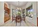 Elegant dining room featuring large windows, a chandelier, and custom built-in cabinetry at 1092 N Roosevelt Ave, Chandler, AZ 85226