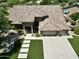 This home features a 3-car garage, manicured front lawn and tile roof at 1092 N Roosevelt Ave, Chandler, AZ 85226