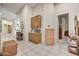 Bright hallway featuring built-in cabinets, tiled floors, and views into adjacent rooms at 1092 N Roosevelt Ave, Chandler, AZ 85226