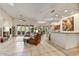 Spacious open-concept living area with tile floors, bar, and seamless access to the outdoor patio at 1092 N Roosevelt Ave, Chandler, AZ 85226