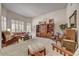 Cozy living room filled with natural light, comfortable furniture, and built-in shelving at 1092 N Roosevelt Ave, Chandler, AZ 85226