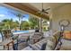 Covered patio with comfortable seating area overlooking the swimming pool and lush backyard at 1092 N Roosevelt Ave, Chandler, AZ 85226