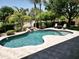 A private backyard pool includes a rock waterfall feature and a spacious patio area at 1092 N Roosevelt Ave, Chandler, AZ 85226