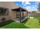 Backyard including a putting green, shaded patio and privacy wall at 11762 E Becker Ln, Scottsdale, AZ 85259