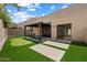 Backyard featuring a putting green, shaded patio and privacy wall at 11762 E Becker Ln, Scottsdale, AZ 85259