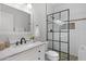 Renovated bathroom with glass shower, modern sink and vanity, and stylish tile accents at 11762 E Becker Ln, Scottsdale, AZ 85259