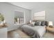 Staged bedroom with a comfortable bed, stylish furnishings, and plenty of natural light from the window at 11762 E Becker Ln, Scottsdale, AZ 85259