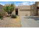 Charming single-story home featuring a well-maintained yard, two-car garage, and desert landscaping at 11762 E Becker Ln, Scottsdale, AZ 85259