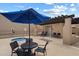 Community pool and spa with lounge chairs, desert landscaping and restroom at 11762 E Becker Ln, Scottsdale, AZ 85259