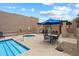 Community pool with spa, lounge chairs, tables and desert landscaping at 11762 E Becker Ln, Scottsdale, AZ 85259