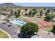 Aerial view of community pool, tennis courts, and meticulously maintained neighborhood at 13408 N 25Th Dr, Phoenix, AZ 85029