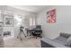 Bedroom features a desk, telescope, and view of the outdoors at 13408 N 25Th Dr, Phoenix, AZ 85029