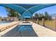 Inviting community pool area featuring shaded seating, perfect for relaxing by the water at 13408 N 25Th Dr, Phoenix, AZ 85029