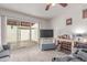 Bright and airy living room with a sliding glass door to the patio at 13408 N 25Th Dr, Phoenix, AZ 85029