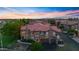 Aerial view of an attractive condo community with desert landscaping and tile roofs at 14250 W Wigwam Blvd # 2722, Litchfield Park, AZ 85340
