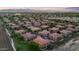 Expansive aerial view of a meticulously planned community with well-maintained homes and lush landscaping at 14250 W Wigwam Blvd # 2722, Litchfield Park, AZ 85340