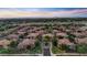 Extensive aerial view of a beautifully designed neighborhood featuring tiled roofs and lush greenery at 14250 W Wigwam Blvd # 2722, Litchfield Park, AZ 85340