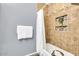 Bathroom featuring a bathtub and a shower with a small decorative inset at 14250 W Wigwam Blvd # 2722, Litchfield Park, AZ 85340
