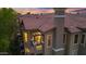 Beautiful two-story condo with balcony, red tile roof and view of colorful sunset at 14250 W Wigwam Blvd # 2722, Litchfield Park, AZ 85340