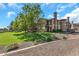 Attractive multi-level condo featuring private balconies, desert landscaping, and lush green lawns at 14250 W Wigwam Blvd # 2722, Litchfield Park, AZ 85340