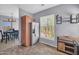 Eat-in kitchen with stainless steel refrigerator and a view to the dining area at 14250 W Wigwam Blvd # 2722, Litchfield Park, AZ 85340