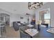 Open floor plan showcases a living room and dining area bathed in natural light at 14250 W Wigwam Blvd # 2722, Litchfield Park, AZ 85340
