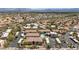 Aerial view of a community featuring multiple tan buildings, desert landscaping, and a community pool at 14815 N Fountain Hills Blvd # 101, Fountain Hills, AZ 85268