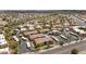 Aerial view of a community featuring multiple tan buildings, desert landscaping, and a community pool at 14815 N Fountain Hills Blvd # 101, Fountain Hills, AZ 85268