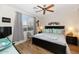Cozy bedroom features wood floors, soft lighting, and a large window at 14815 N Fountain Hills Blvd # 101, Fountain Hills, AZ 85268