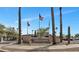 Eagles Landing community entrance with desert landscaping, flags, and signage at 14815 N Fountain Hills Blvd # 101, Fountain Hills, AZ 85268