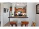 A Kitchen with granite countertops and stainless steel appliances with convenient seating at 14815 N Fountain Hills Blvd # 101, Fountain Hills, AZ 85268