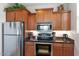 Well-lit kitchen featuring stainless steel appliances, granite countertops, and ample cabinetry at 14815 N Fountain Hills Blvd # 101, Fountain Hills, AZ 85268