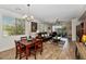 Open-concept living room with wood floors, dining area, modern furniture, and lots of natural light at 14815 N Fountain Hills Blvd # 101, Fountain Hills, AZ 85268