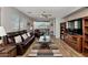 Relaxing living room with wood floors, leather furniture, ceiling fan, and access to a private patio at 14815 N Fountain Hills Blvd # 101, Fountain Hills, AZ 85268