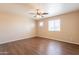 Bedroom featuring wood floors and large windows at 16021 N 30Th St # 122, Phoenix, AZ 85032