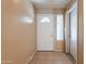 Bright entryway featuring tile flooring, neutral walls, and front door with sidelight window at 16021 N 30Th St # 122, Phoenix, AZ 85032