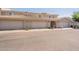 Attractive townhouse featuring a beige facade, two-car garage, and tiled roof at 16021 N 30Th St # 122, Phoenix, AZ 85032