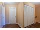 Hallway with closet and laminate flooring at 16021 N 30Th St # 122, Phoenix, AZ 85032
