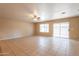 Spacious living room featuring tile floors and a sliding glass door at 16021 N 30Th St # 122, Phoenix, AZ 85032