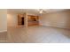 Open-concept floor plan with tile flooring and views of the kitchen at 16021 N 30Th St # 122, Phoenix, AZ 85032