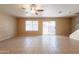 Tile floor living room featuring staircase, windows and a sliding glass door at 16021 N 30Th St # 122, Phoenix, AZ 85032