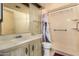 This bathroom features a shower and a sink with light pink marble-style countertops at 16215 N 35Th Way, Phoenix, AZ 85032